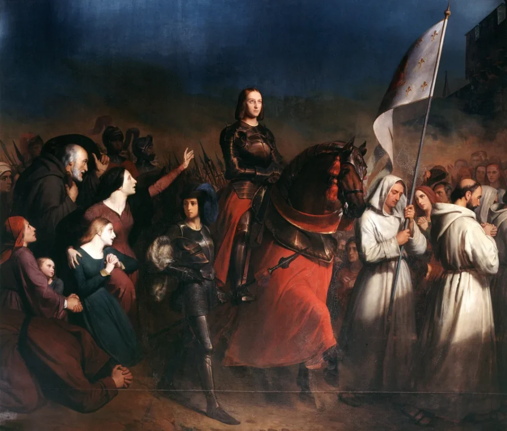Joan of Arc in gleaming armor rides on a horse with monks in front of her and adoring peasants all around