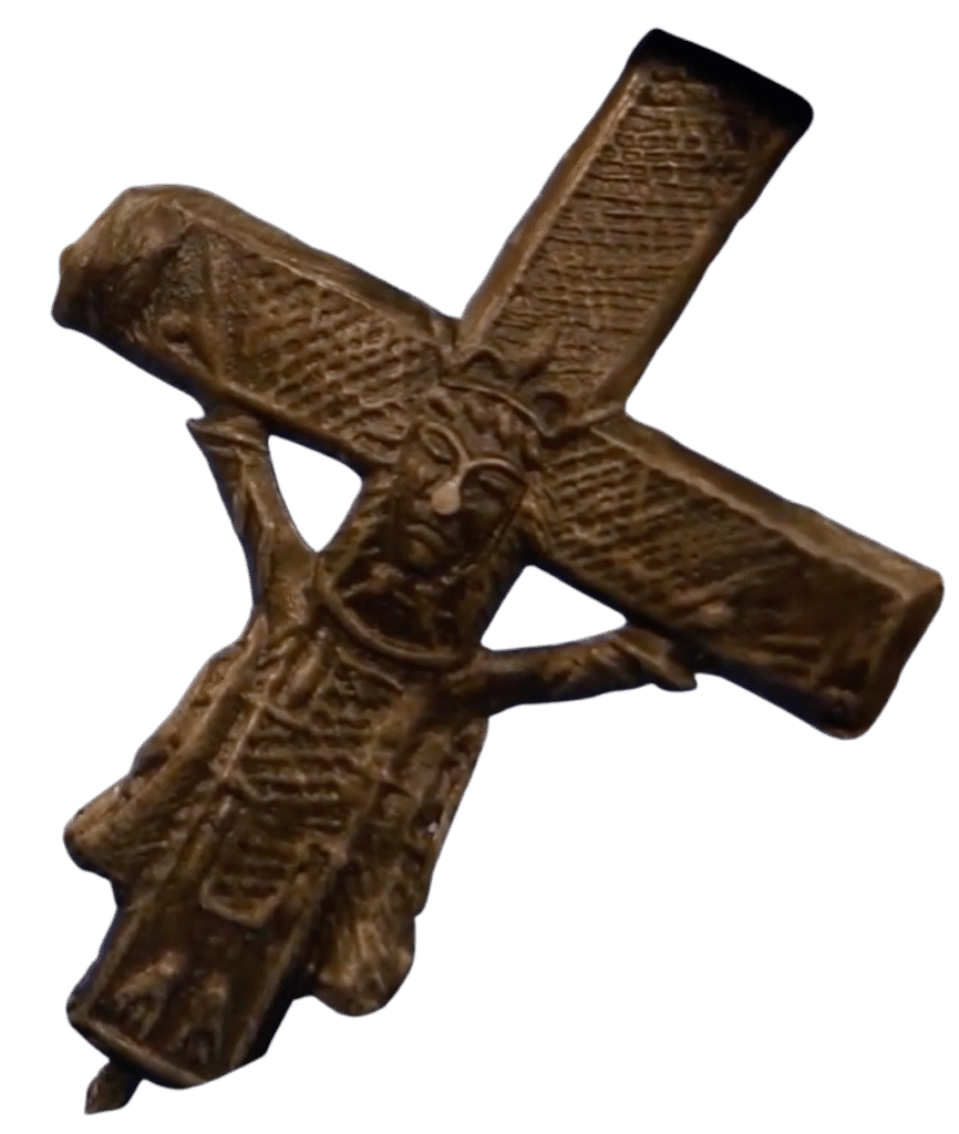 old crucifix featuring a bearded robed figure