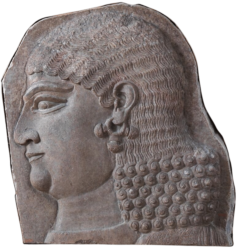 gray stone head of a beardless royal attendant, possibly a eunuch